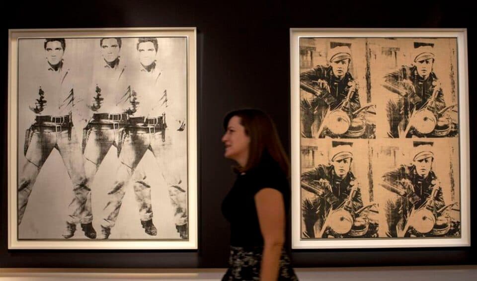 Two Warhols fetch $153 million to lead Christie’s record-setting art auction